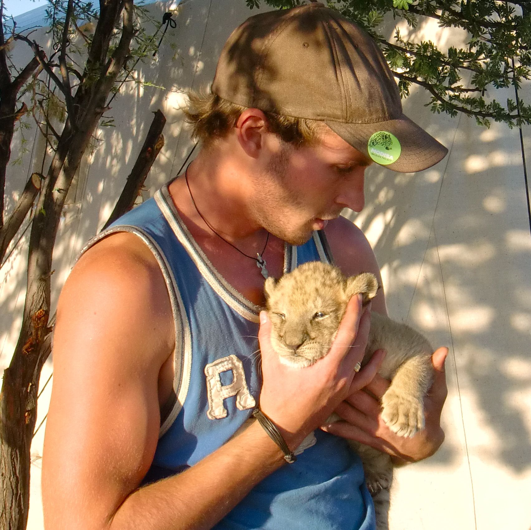 Young Valentin holding baby Sirga as a newborn cub